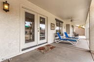 view of patio featuring ceiling fan and covered porch