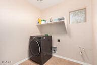 laundry room with washer / dryer