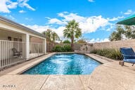 view of swimming pool with a patio