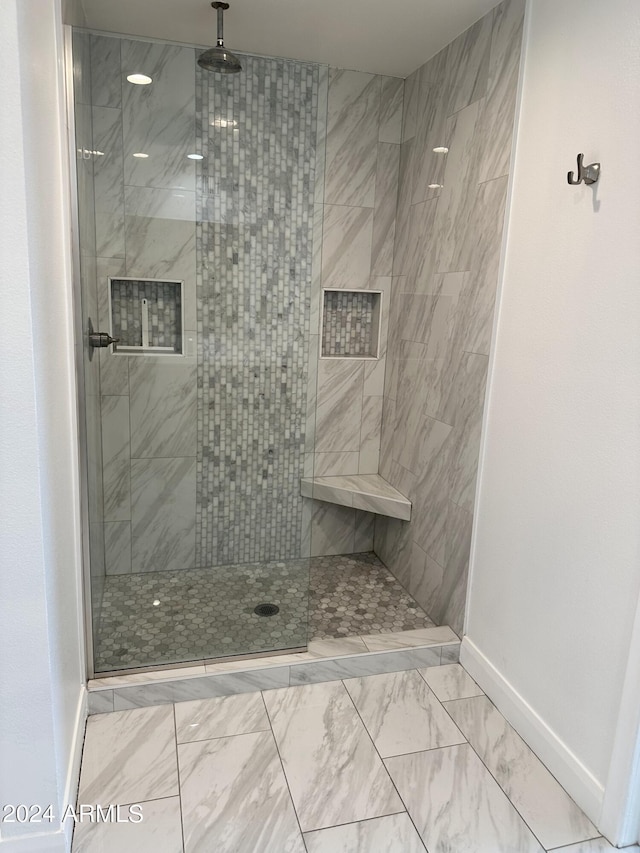 bathroom featuring tiled shower