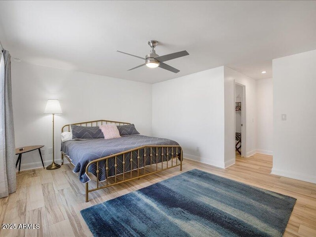 bedroom with hardwood / wood-style flooring and ceiling fan