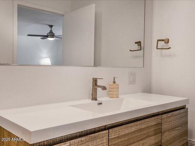 bathroom with ceiling fan and vanity