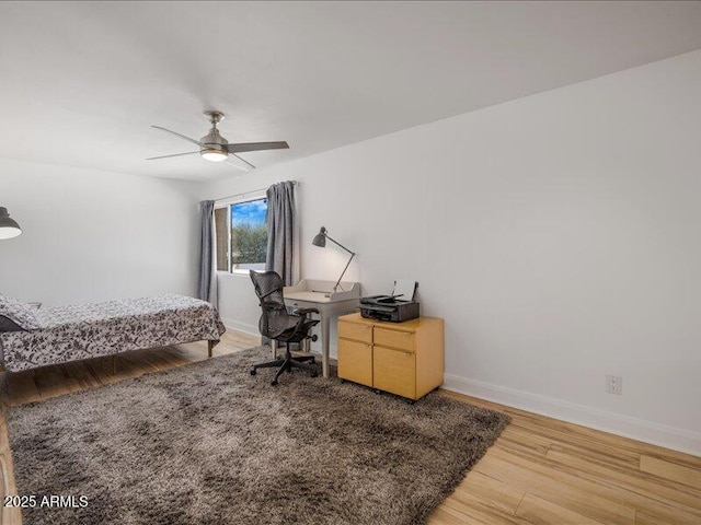 bedroom featuring ceiling fan and wood-type flooring