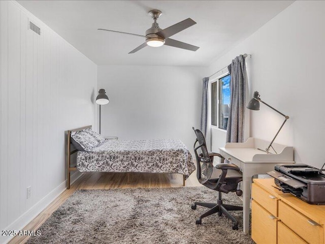 bedroom featuring wood-type flooring and ceiling fan