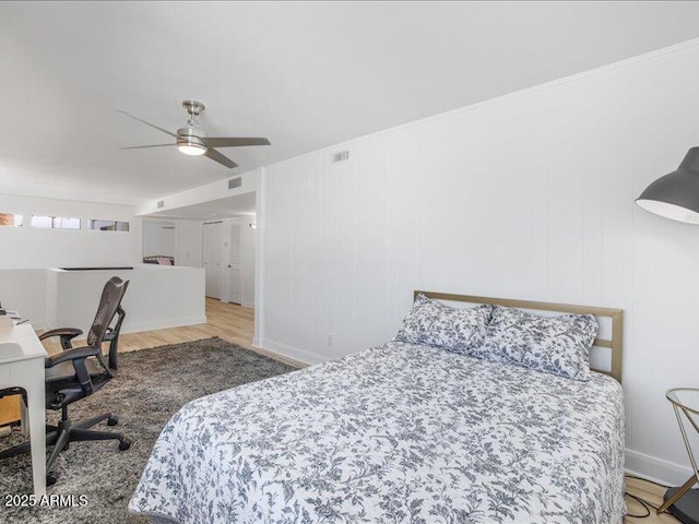 bedroom featuring light hardwood / wood-style flooring and ceiling fan