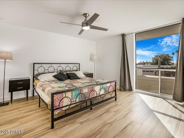 bedroom with ceiling fan and light wood-type flooring