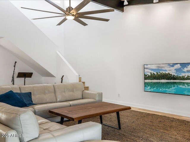 living room featuring hardwood / wood-style flooring and ceiling fan