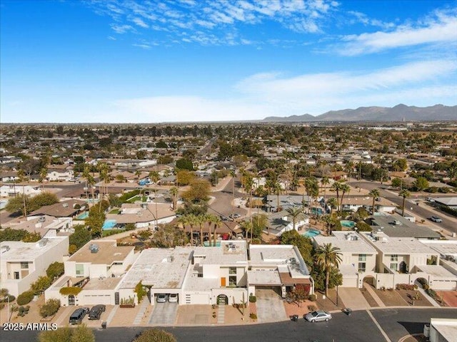 birds eye view of property featuring a mountain view