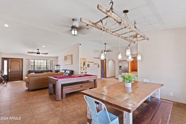 dining area featuring light tile patterned floors, lofted ceiling, and ceiling fan