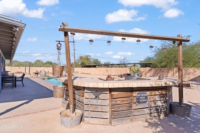 view of patio / terrace featuring a community pool