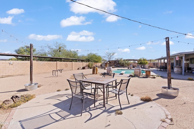 view of patio featuring a fenced in pool