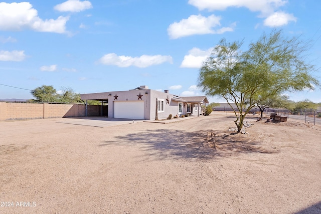 southwest-style home featuring a garage