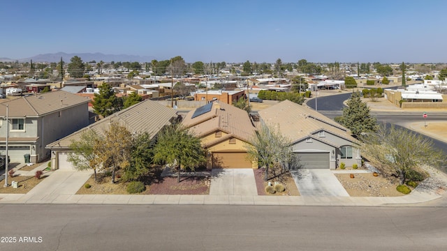 drone / aerial view featuring a mountain view and a residential view