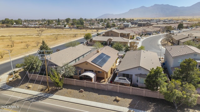 drone / aerial view with a residential view and a mountain view