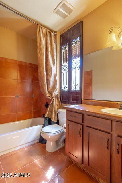 full bath featuring visible vents, toilet, tile patterned flooring, shower / bath combination with curtain, and vanity