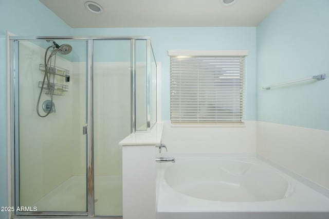 bathroom featuring plus walk in shower