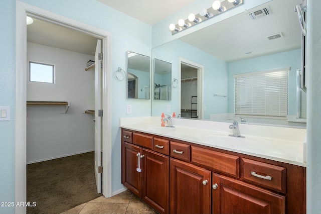 bathroom with vanity and tile patterned flooring