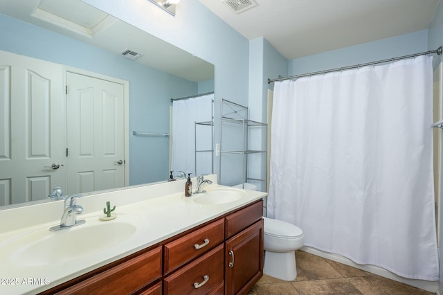 bathroom featuring vanity, toilet, curtained shower, and tile patterned flooring