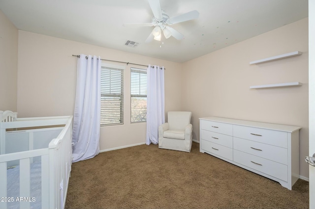 unfurnished bedroom featuring ceiling fan and dark colored carpet