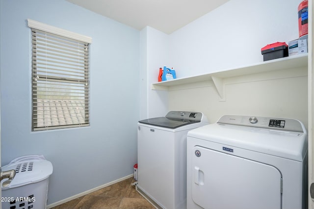 clothes washing area with washer and dryer