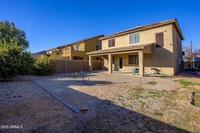 rear view of house featuring a patio