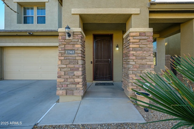 entrance to property featuring a garage