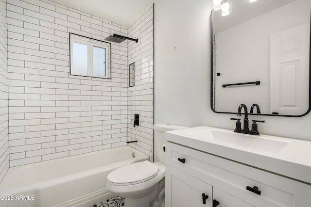 full bathroom with tiled shower / bath, vanity, and toilet