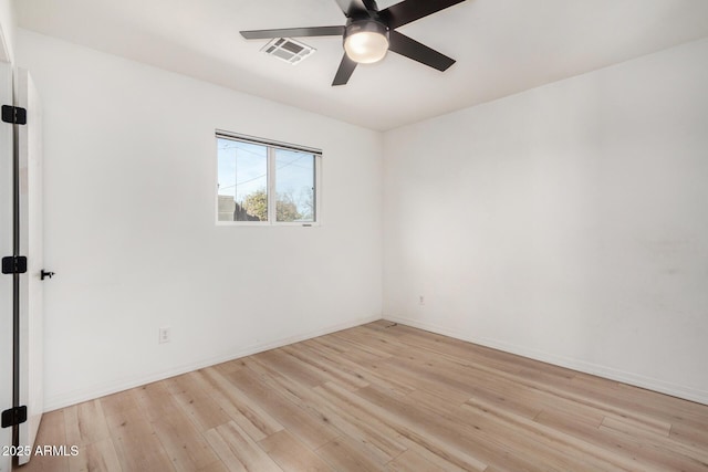 spare room featuring ceiling fan and light hardwood / wood-style flooring