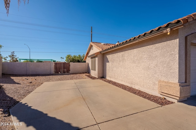 view of home's exterior with a patio area