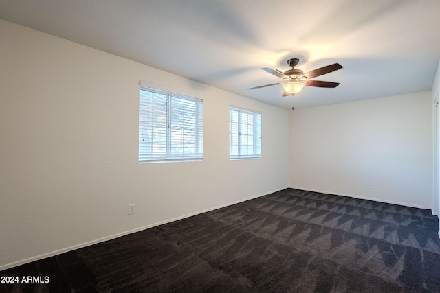 carpeted empty room with ceiling fan