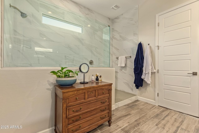 10447 W Salter Dr, Peoria, AZ 85382 - full bath with a walk in shower, wood finished floors, and baseboards