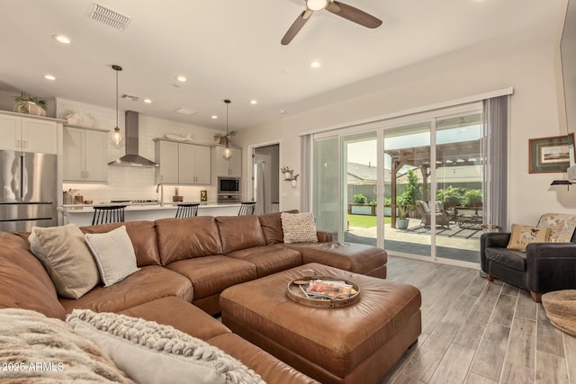 10447 W Salter Dr, Peoria, AZ 85382 - living area featuring light wood-style flooring, recessed lighting, and ceiling fan