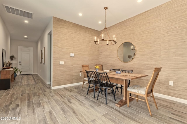 10447 W Salter Dr, Peoria, AZ 85382 - dining room with baseboards, wood finished floors, recessed lighting, and a chandelier