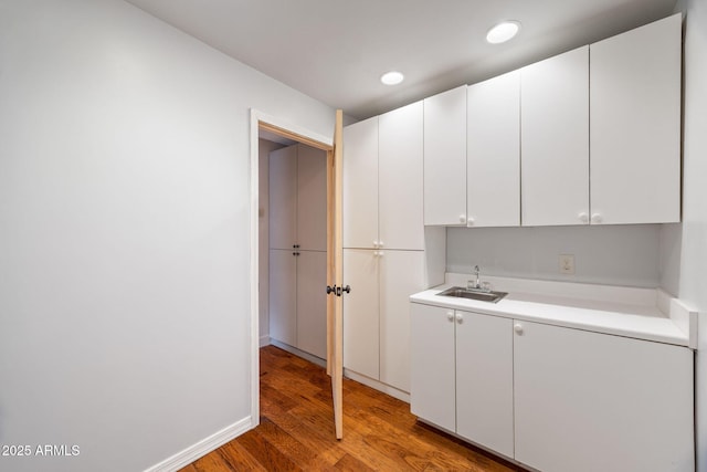 103 E Glade Ln, Payson, AZ 85541 - kitchen with light wood-type flooring, light countertops, white cabinetry, and recessed lighting