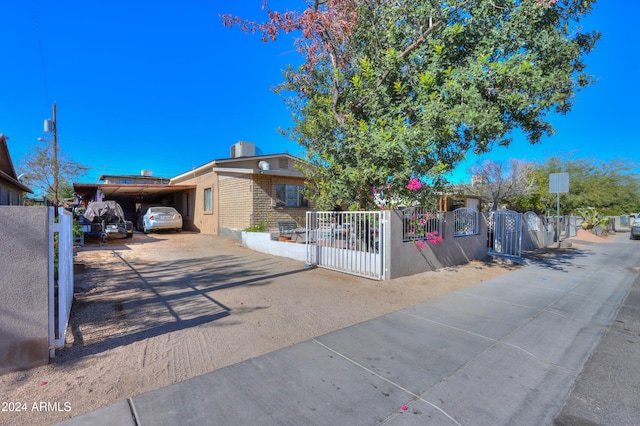 view of front of property featuring a carport