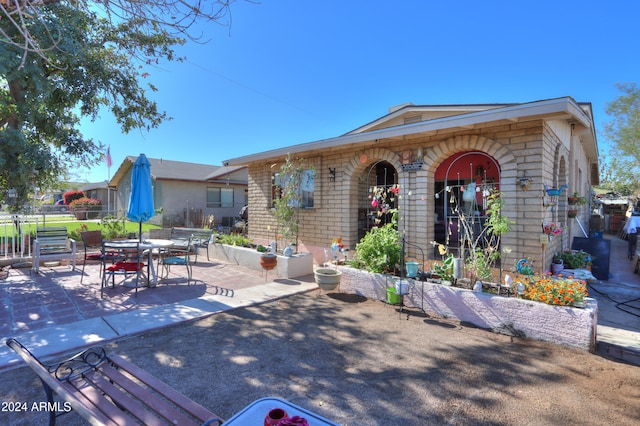 view of front of home featuring a patio area