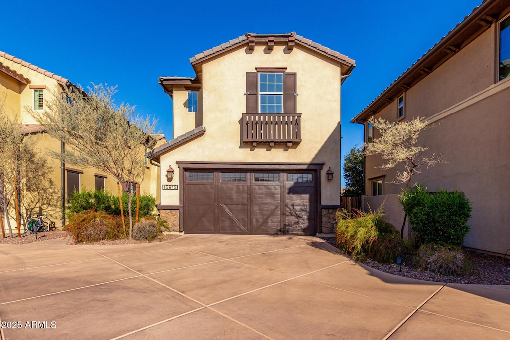 mediterranean / spanish-style home featuring a garage