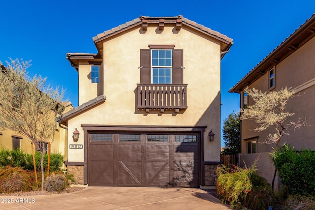 mediterranean / spanish home featuring a garage