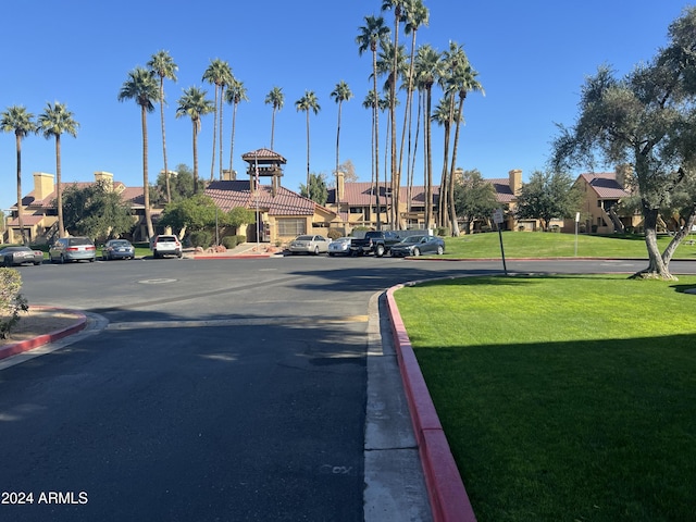 view of road with a residential view and curbs