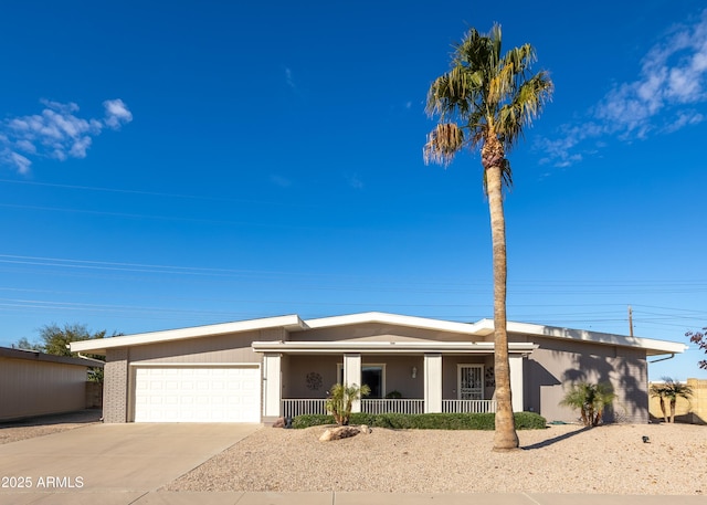 view of front of property featuring a garage and covered porch