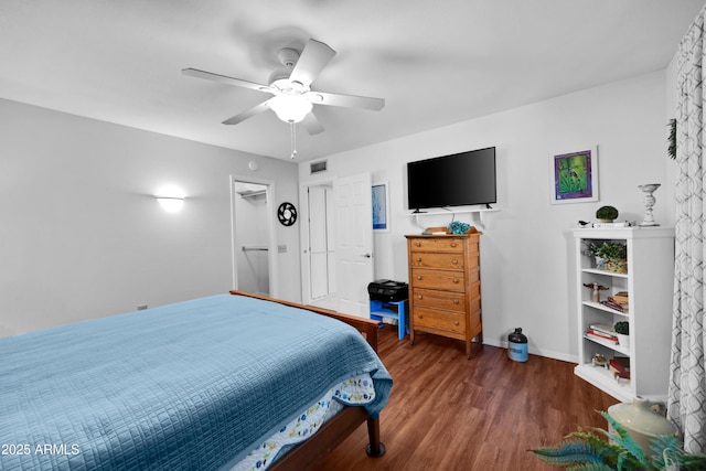 bedroom with dark wood-type flooring and ceiling fan