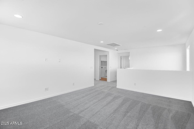 empty room with baseboards, carpet, visible vents, and recessed lighting