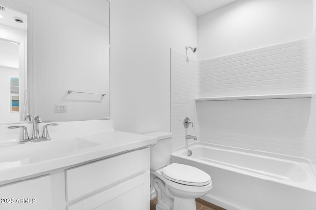 bathroom with vanity, toilet, and shower / bathtub combination