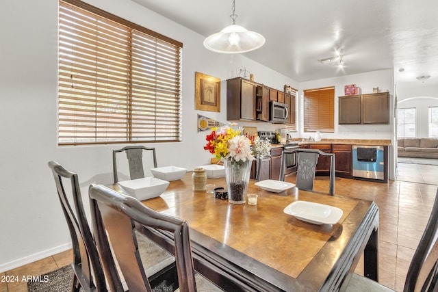 dining space with light tile patterned floors