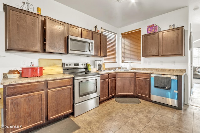 kitchen with appliances with stainless steel finishes and sink