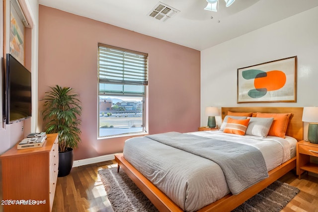 bedroom featuring ceiling fan and wood-type flooring