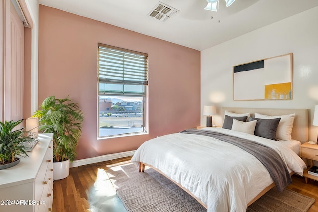 bedroom featuring ceiling fan and dark hardwood / wood-style floors