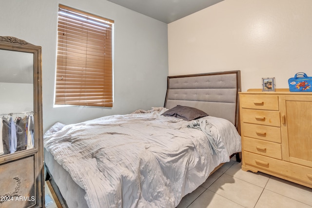 bedroom featuring light tile patterned floors