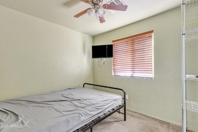 bedroom featuring ceiling fan and light colored carpet