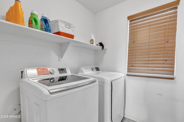 laundry area featuring washing machine and clothes dryer